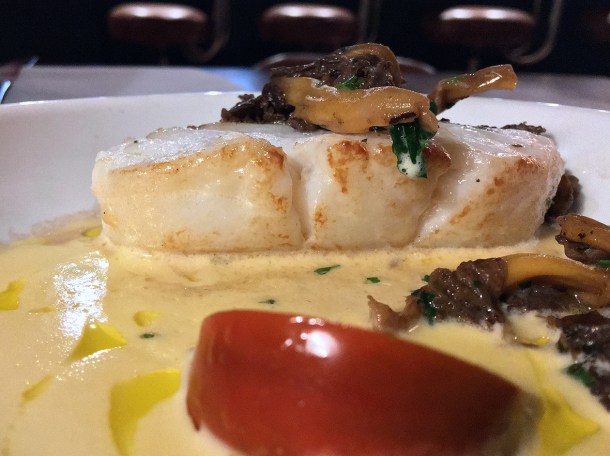 illustrative photo of the cod with mushrooms and tomato at Opera Tavern