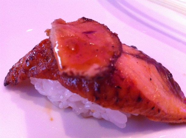 A close up of an unagi and foie gras nigiri