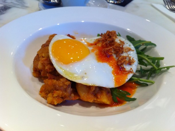 chorizo hash with a fried egg, rocket, salsa verde & crispy shallots
