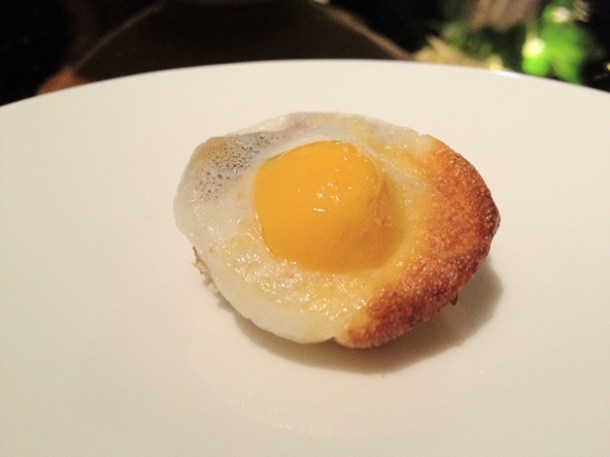quail egg - carrot and mimolette on brown bread at Moments Barcelona quail egg - carrot and mimolette on brown bread amuse bouche at moments mandarin oriental hotel barcelona