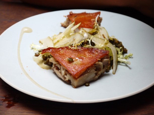 confit of suckling pig with roasted cashews, pear and lentils at lima rathbone place