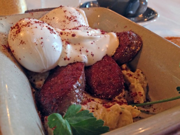 aubergine puree, poached eggs, yoghurt, parsley and toast with soutzouki sausage at caravan kings cross