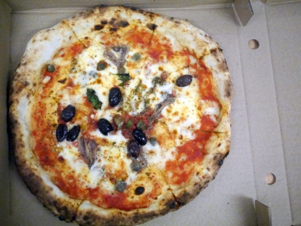 tomato, garlic, oregano, capers, olives, anchovies & mozzarella pizza from franco manca