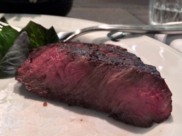 slice of flat iron steak at q grill