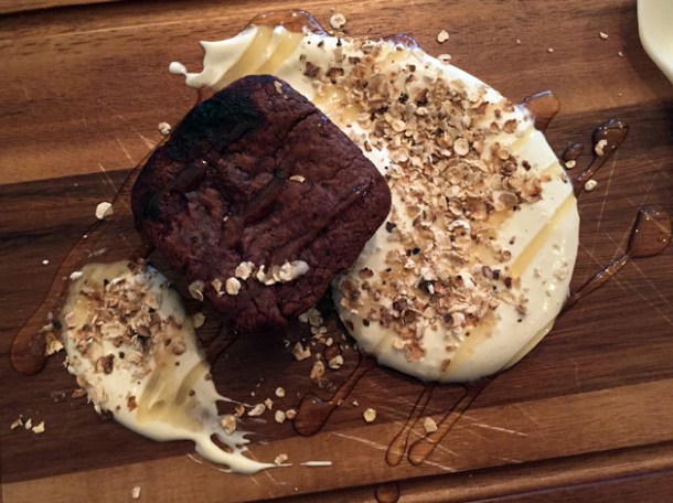 brownie with oats and honey cream at wild game co
