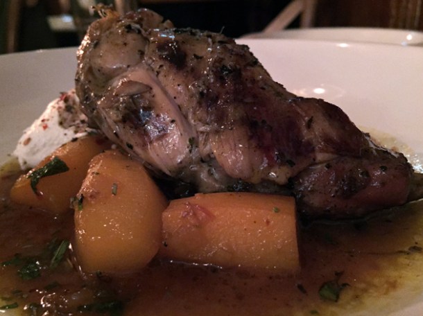rabbit leg slow cooked with potatoes, saffron and prunes tagine at peckham bazaar