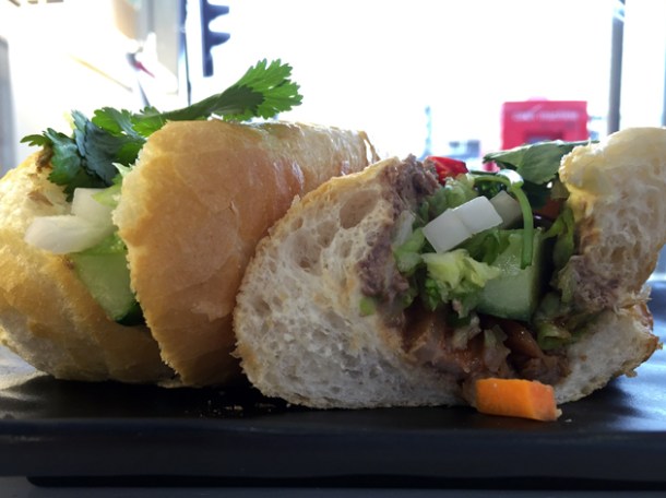 pork belly with wild boar pate banh mi at oi hanoi
