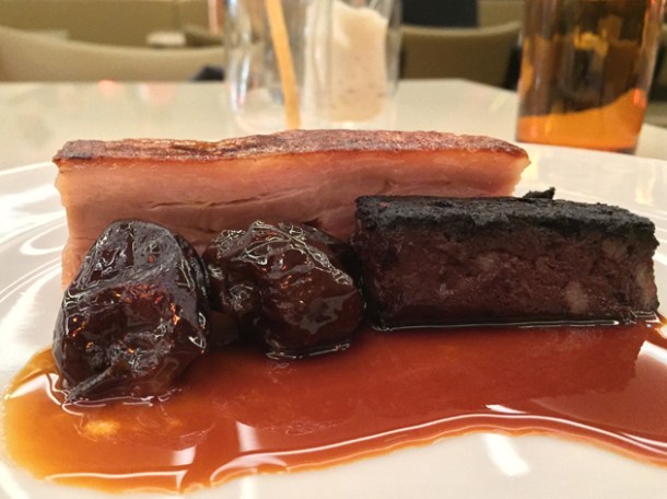 pressed suckling pig with prunes, black pudding and cauliflower puree at piquet
