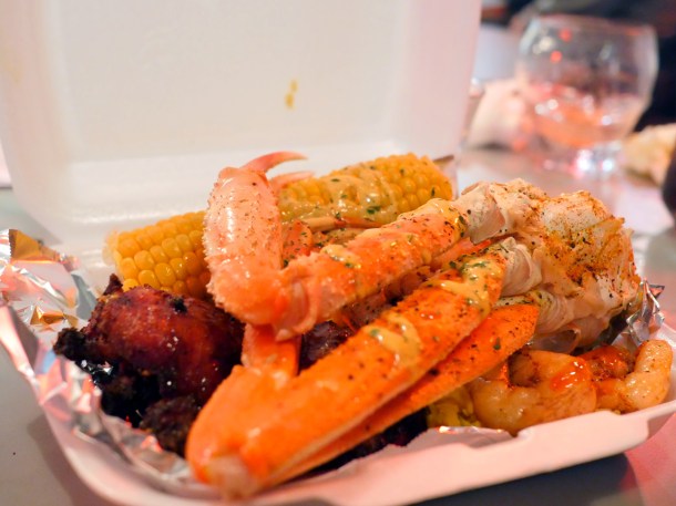 illustrative photo of the snow crab legs and jerk chicken at Trap Kitchen Balham
