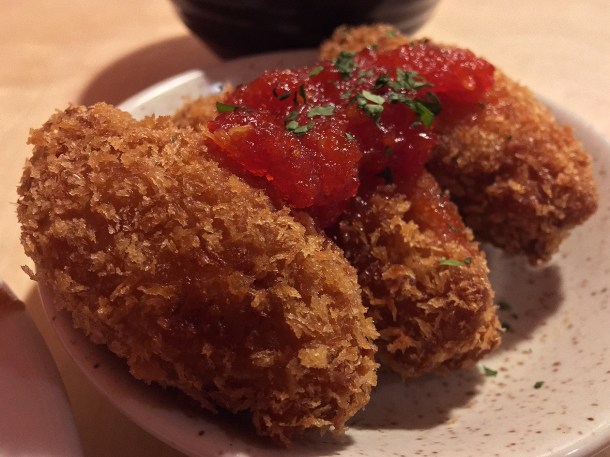 illustrative photo of the ojojo water yam and smoked mackerel croquettes with scotch bonnet jam at Chuku's