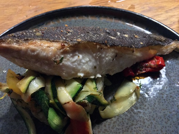 illustrative photo of the halibut with courgettes and new potatoes at The Vine Tree Llangattock