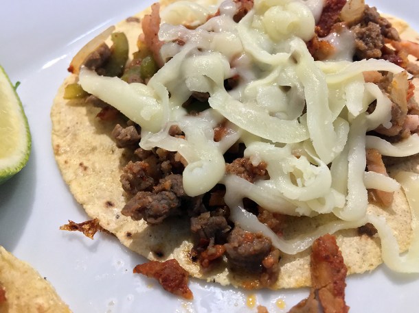 illustrative photo of the alambre meat and cheese tacos at La Chingada