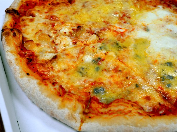 illustrative photo from the four cheeses pizza from Greenwood