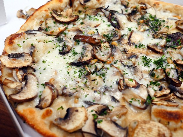 illustrative photo of the mushroom and pine nut vegan pizza from Gourmet Pizza Co