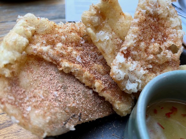 illustrative photo of the deep fried chicken skin at Sarap Bistro Mayfair