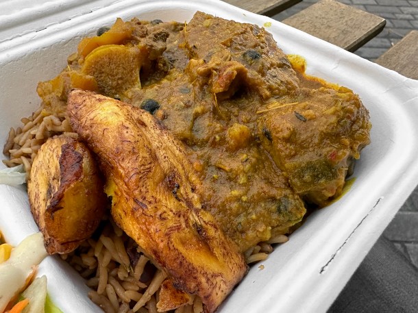 illustrative photo of the curry goat with jollof at Jerk Yard