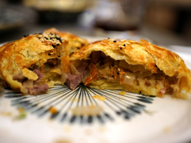 illustrative photo of a cut-open somosa at Uzbek Corner