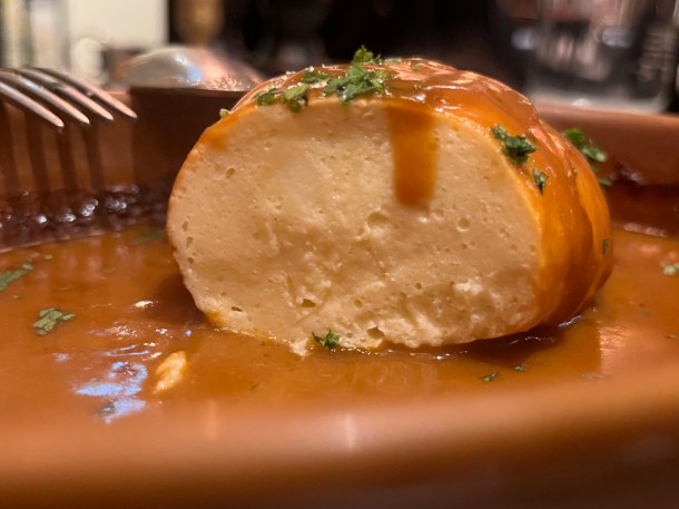 illustrative photo of the quenelle pike mousse in langoustine sauce at Josephine Bouchon